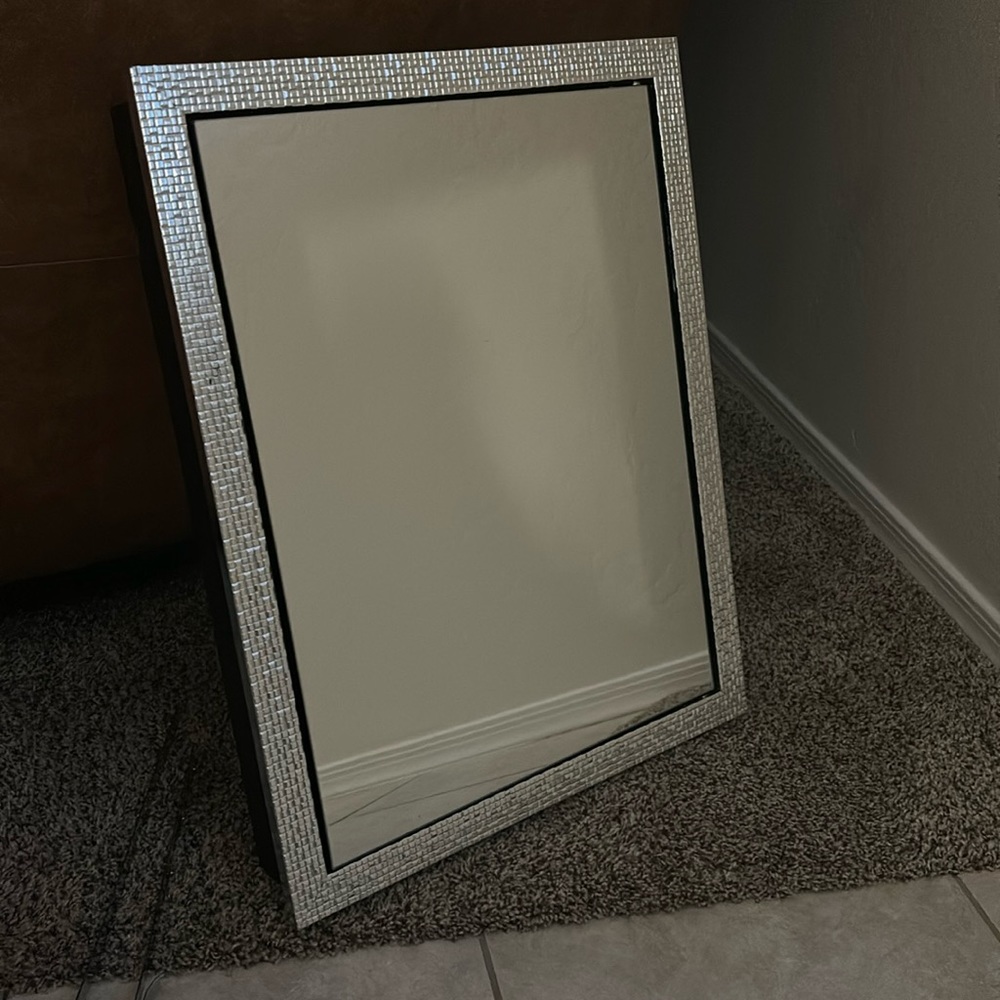 Hanging mirror with jewelry space inside